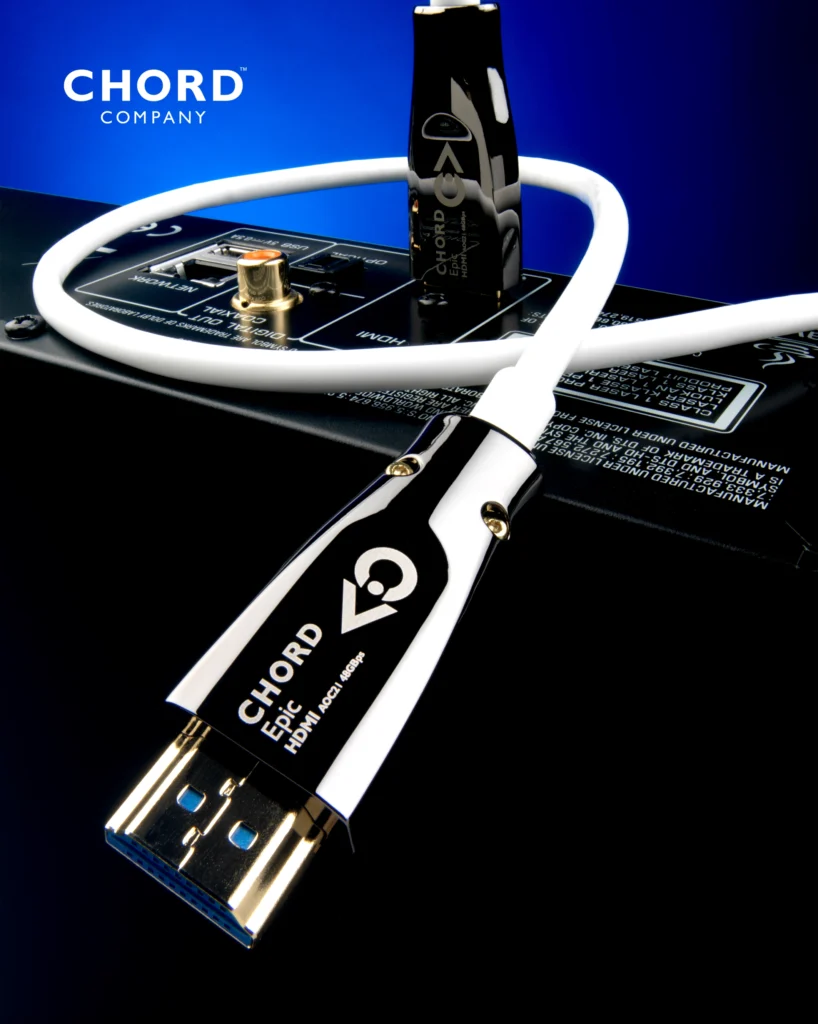 Chord Company Epic HDMI cable with polished metal connectors lying across the back of a component.