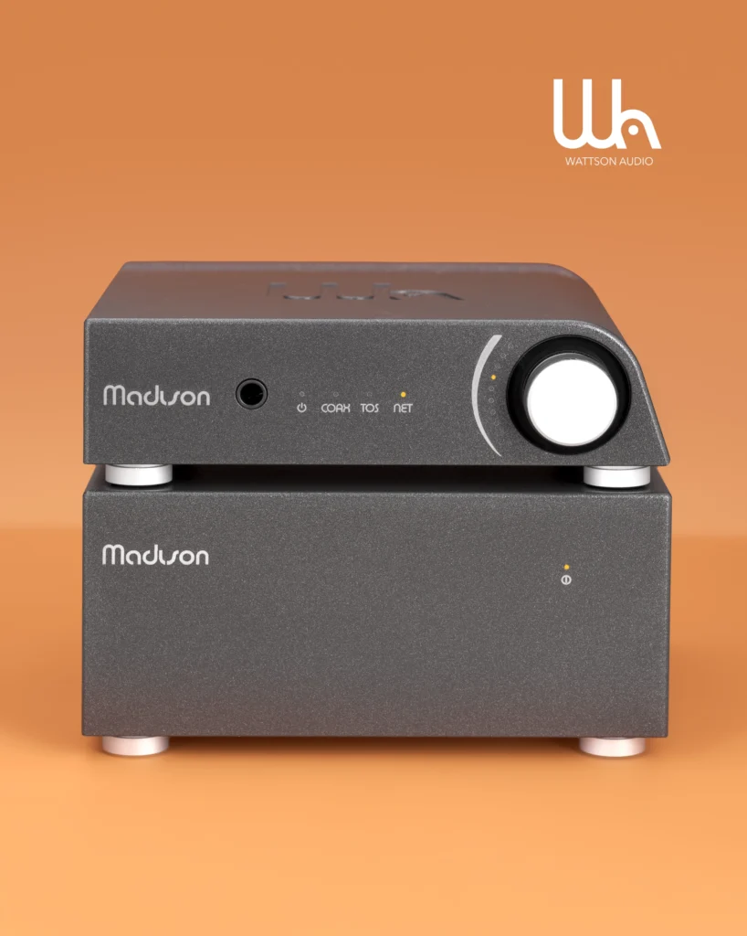 Wattson Audio Madison streamer with a large volume knob, stacked on a matching grey unit, on orange.