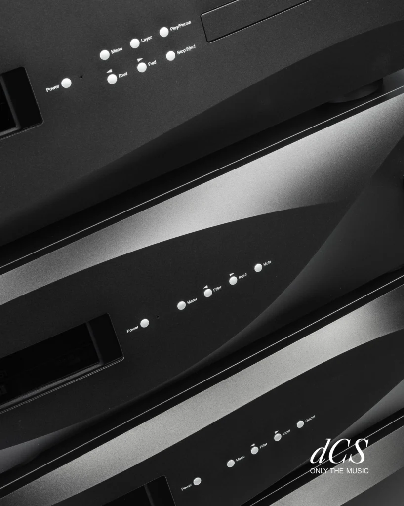 Close-up of stacked black dCS components with small round buttons and display windows.
