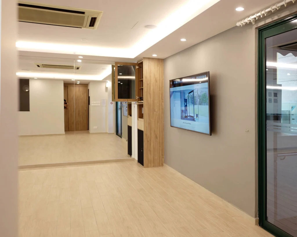 Function room with a wall-mounted screen, timber cabinetry and a ceiling air-conditioner