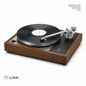 Linn Majik LP12 turntable with a walnut plinth and silver tonearm, with a record on the platter.
