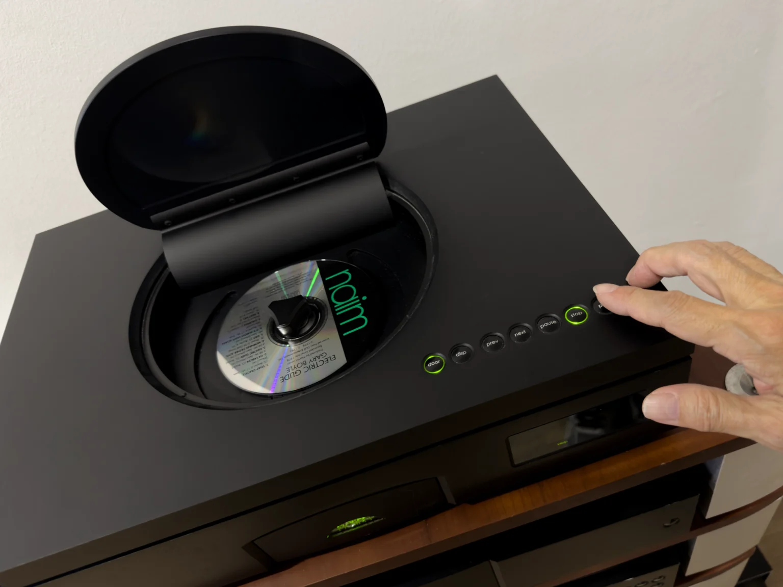 Opening the disc lid of a Naim CD555 CD player